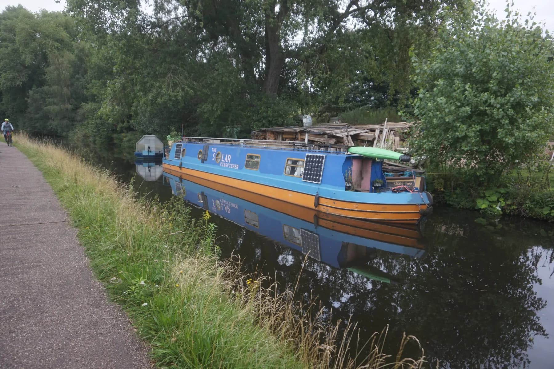 A narrowboat with roof-mounted solar panels moored on the Worcester and Birmingham Canal